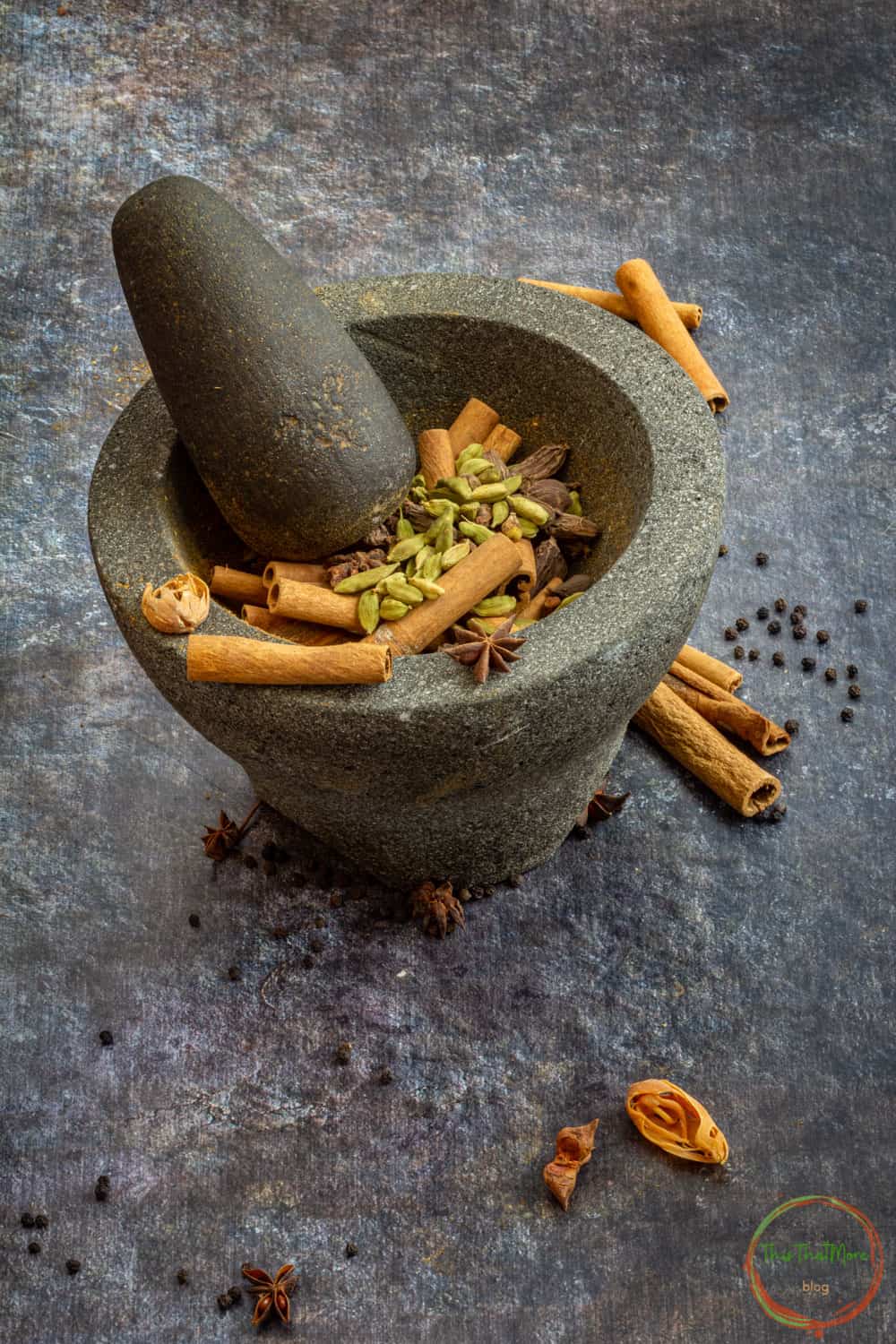Grounding the spices in mortar pestle. 