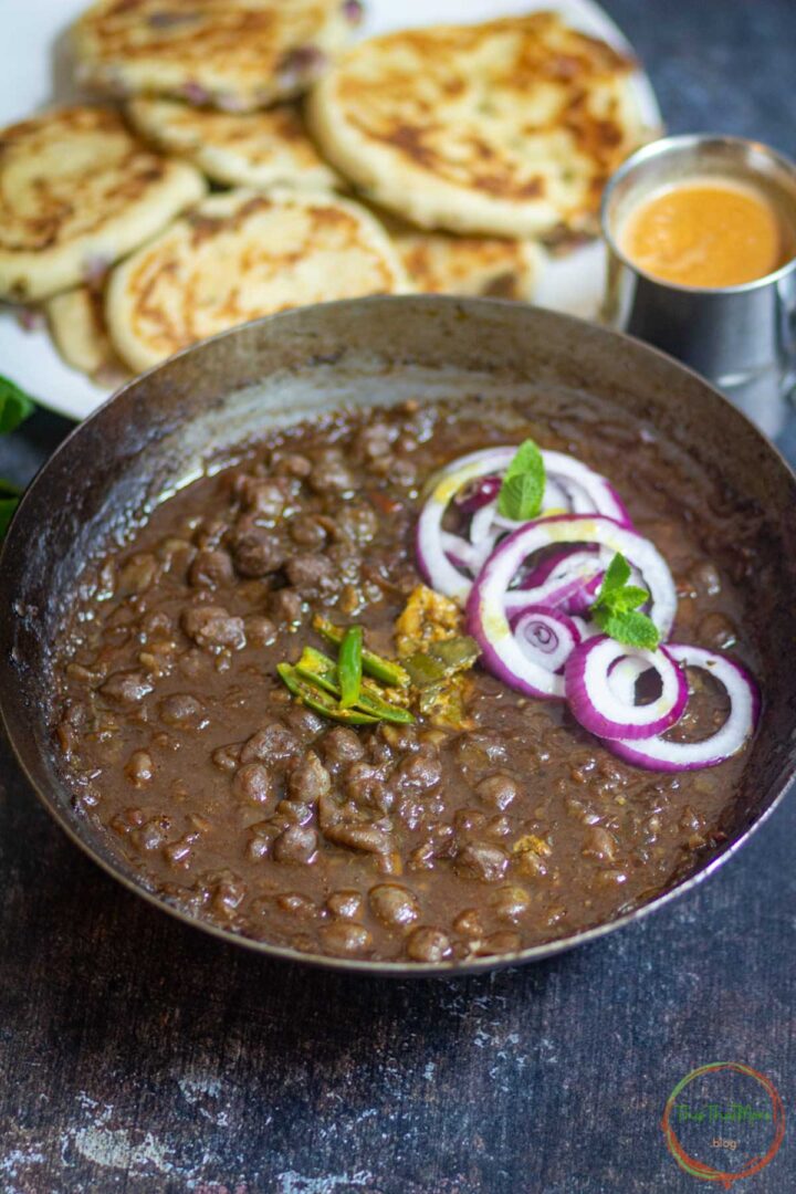 Delhi style chole served with kulcha and onion salad.