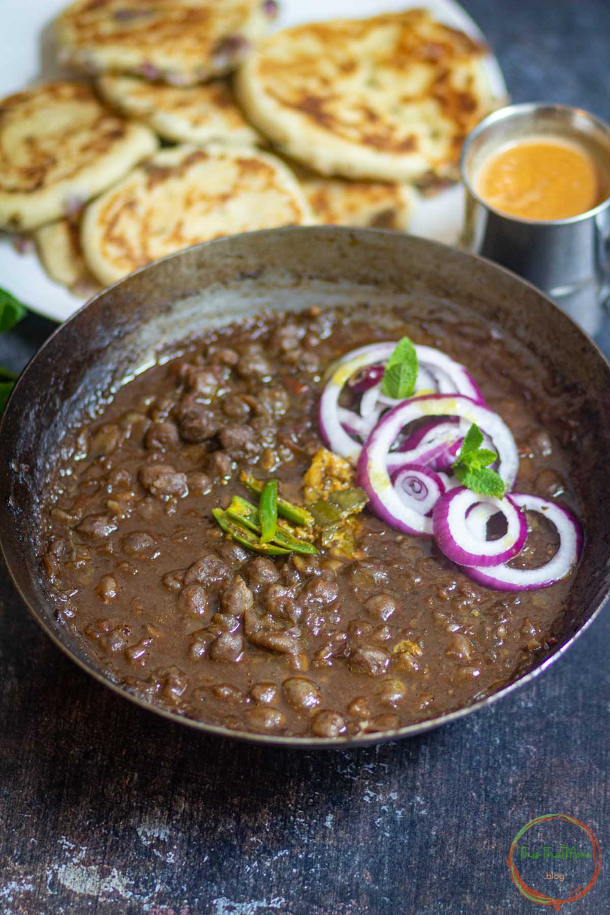 Delhi style chole served with kulcha and onion salad.