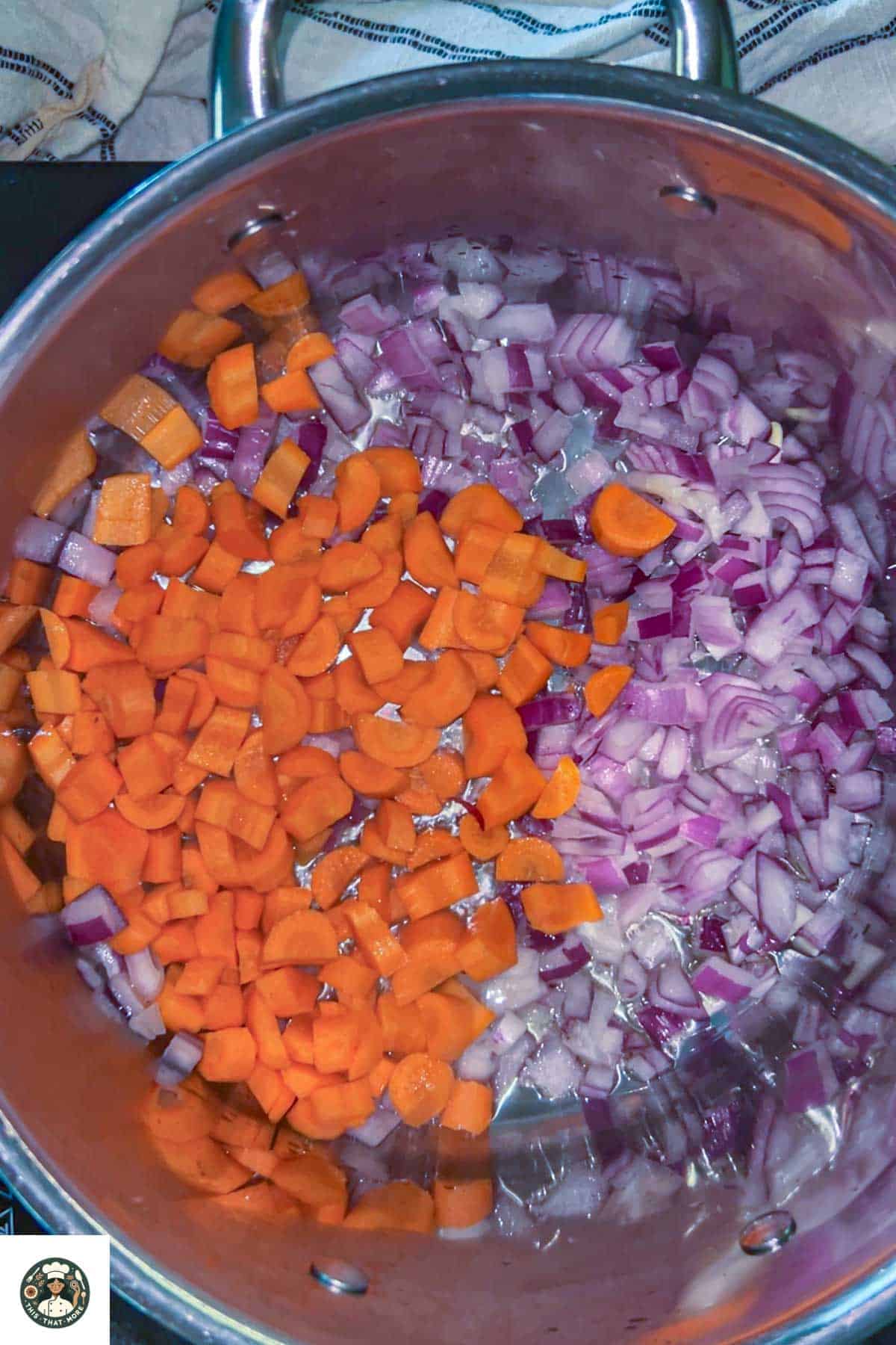 In a big steel pot, saute onions, carrots, garlic, in olive oil.