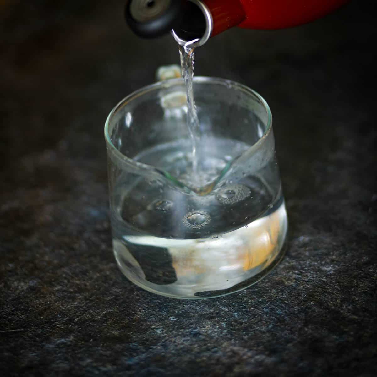 Add boiling water in the teapot.