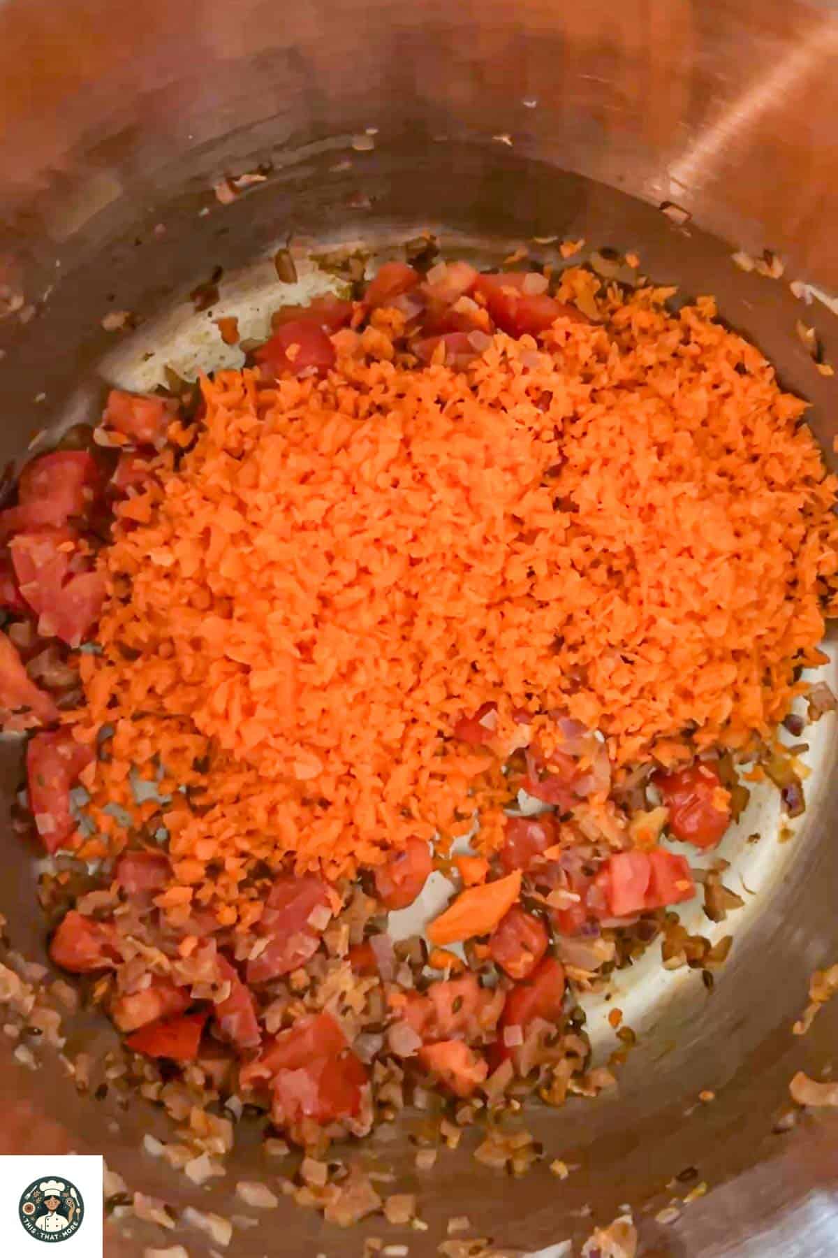 Image of grated carrots added in the pot.