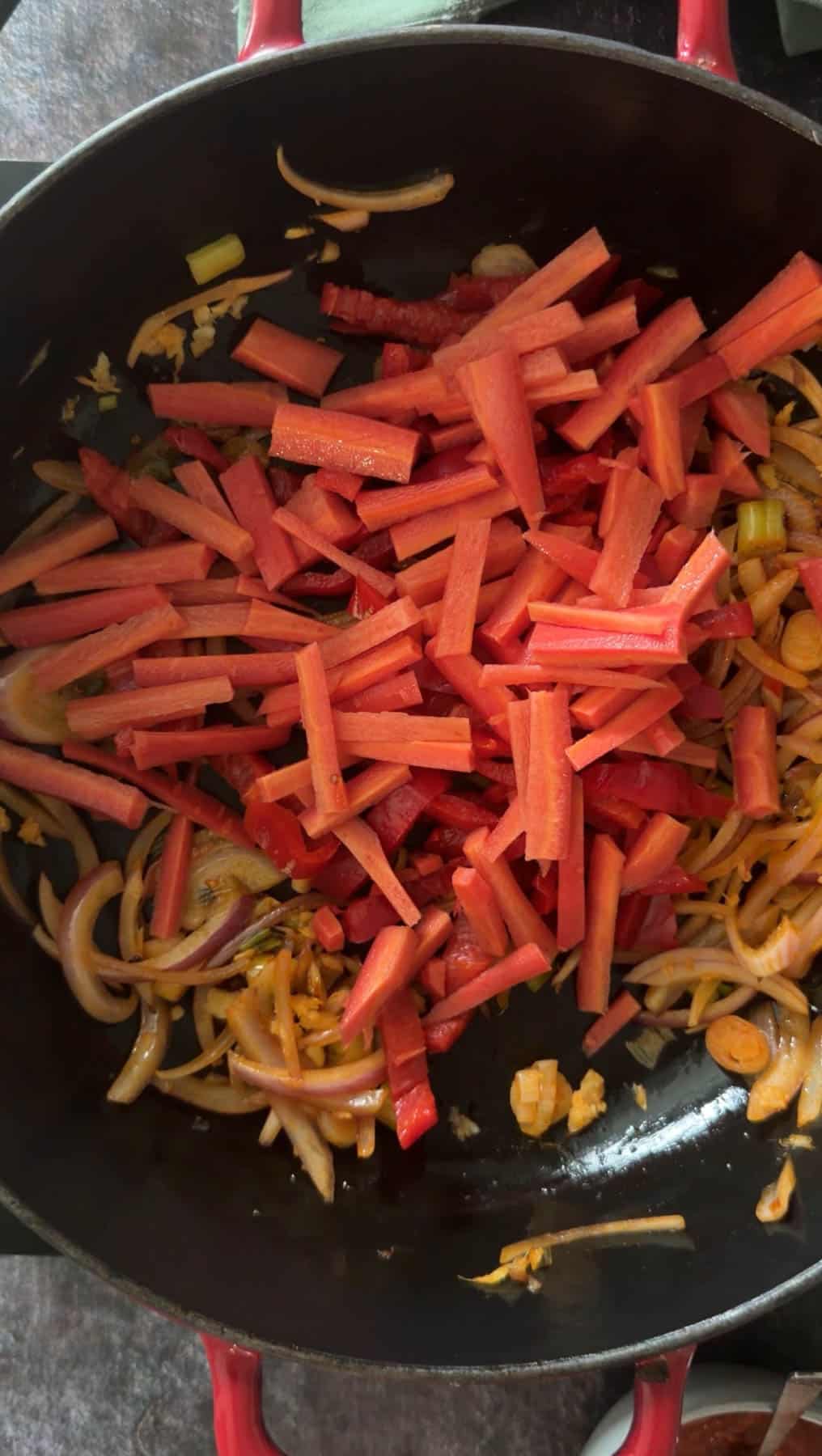 Add veggies like carrots and bell peppers and saute for 2-3 minutes.