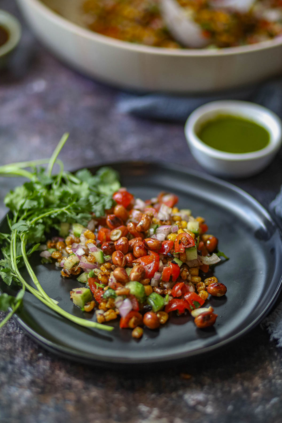 Charred corn chaat served with green chutney.