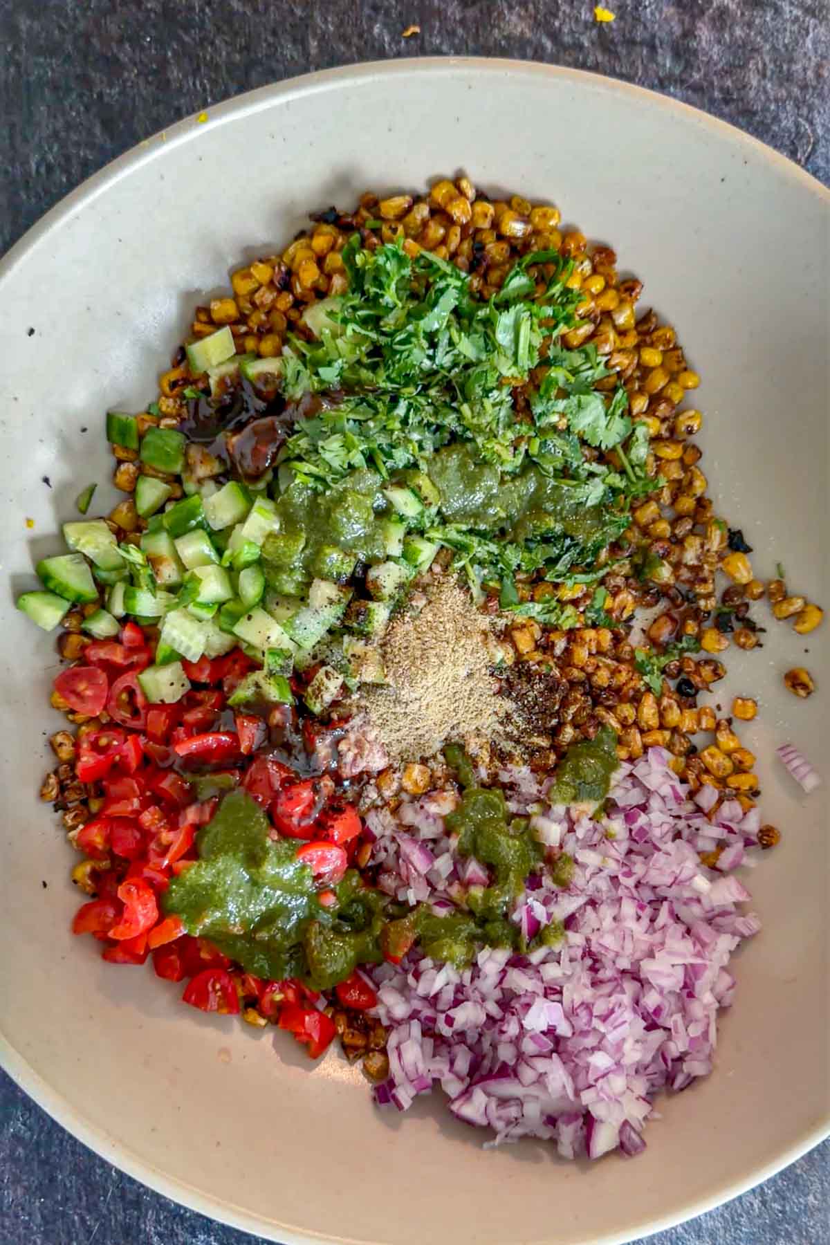 Green and tamarind chutneys added to corn chaat.