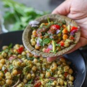 Matar chaat served with chutneys and fresh cilantro.