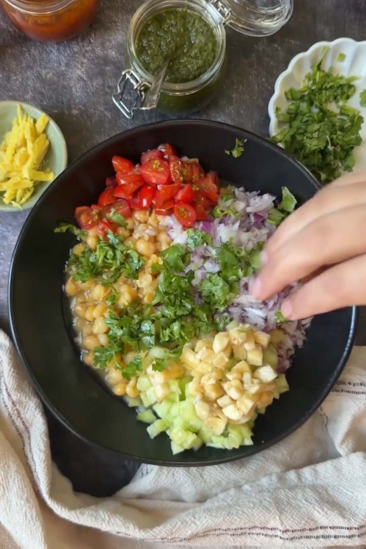 Cooked white peas with onion, tomato, cucumber, banana and cilantro.
