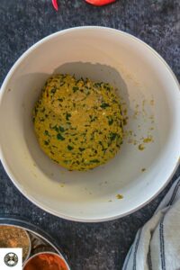 Image of the dough in a white bowl.