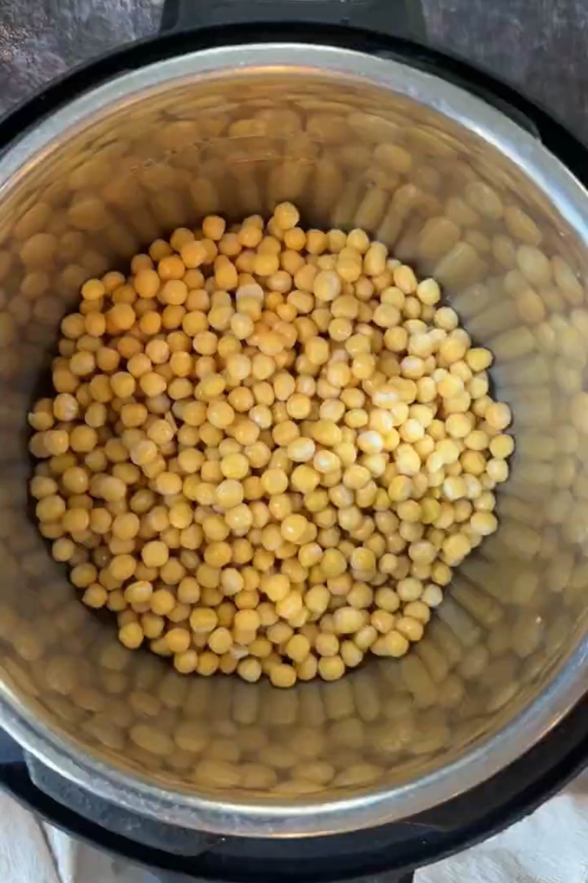 Soaked white peas in an Instant Pot before cooking.