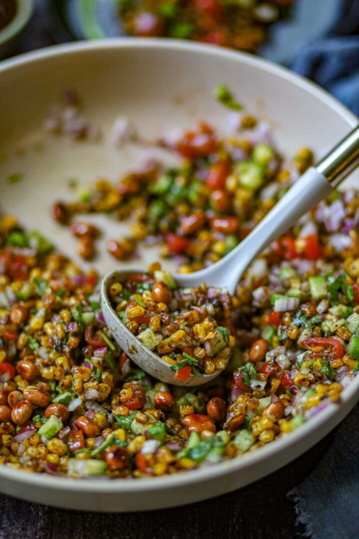 Street-style charred corn chaat in a serving bowl.