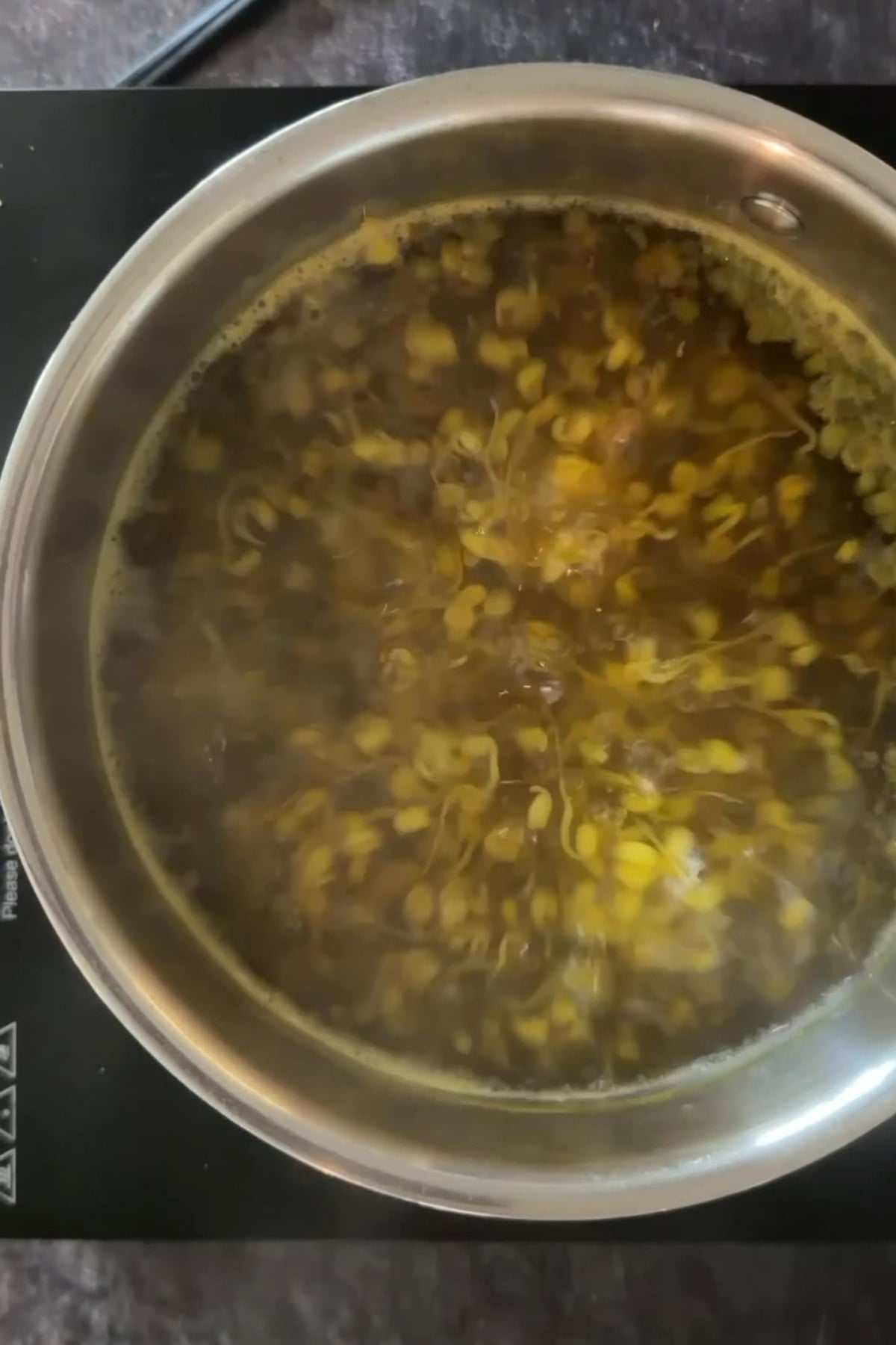 Sprouts boiling with turmeric before making sprouts chaat.