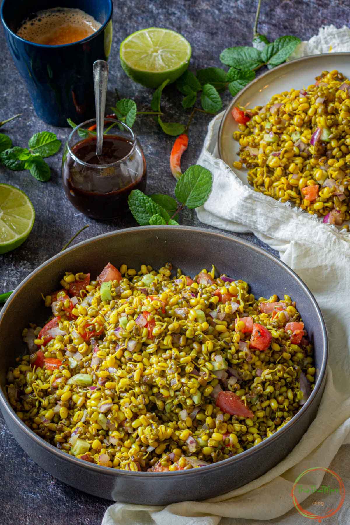 Sprouts chaat with corn, onion, cucumber and tomatoes.