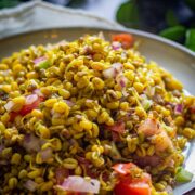 Close-up of sprouts chaat with vegetables and spices.