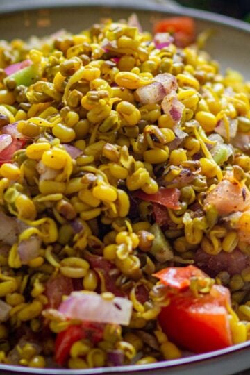 Sprouts chaat made with cooked sprouts, corn and vegetables.