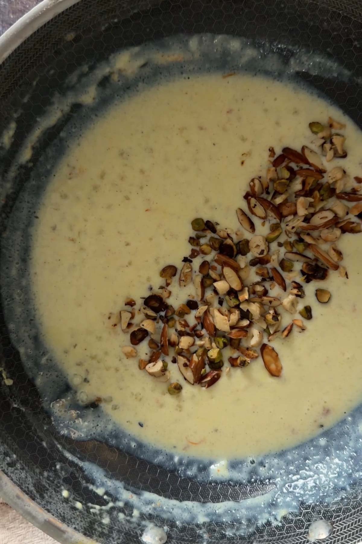 Chopped nuts added to sabudana kheer.