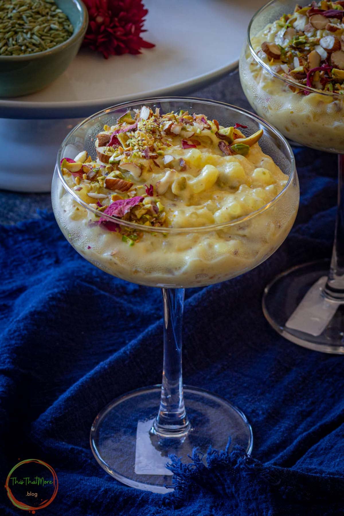 Sabudana kheer topped with chopped nuts and saffron.