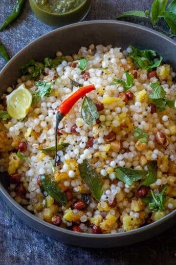 Sabudana khichdi with potatoes, peanuts, curry leaves and lemon.