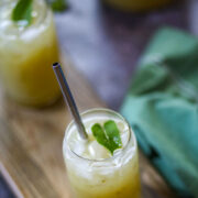 Refreshing aam panna drink served with ice and mint.