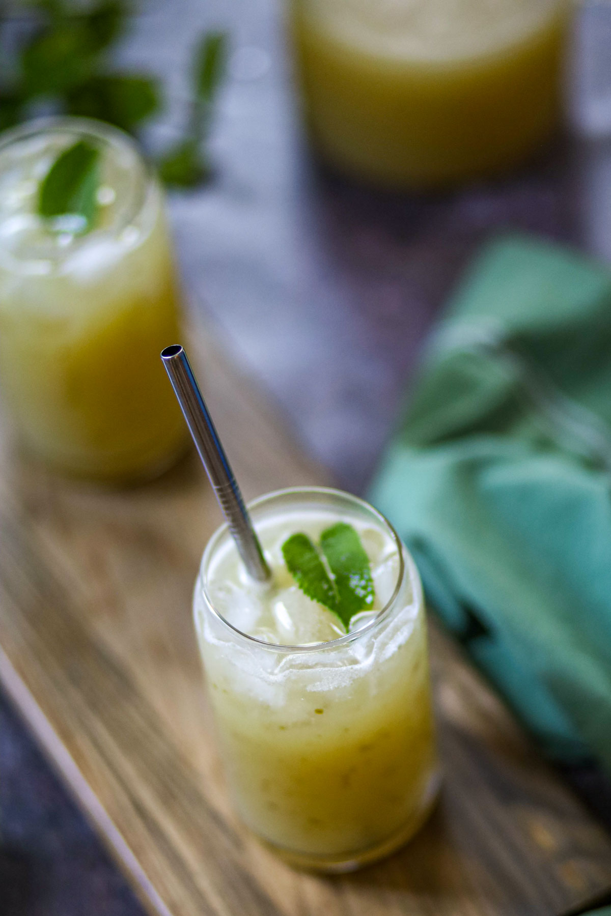 Refreshing aam panna drink served with ice and mint.