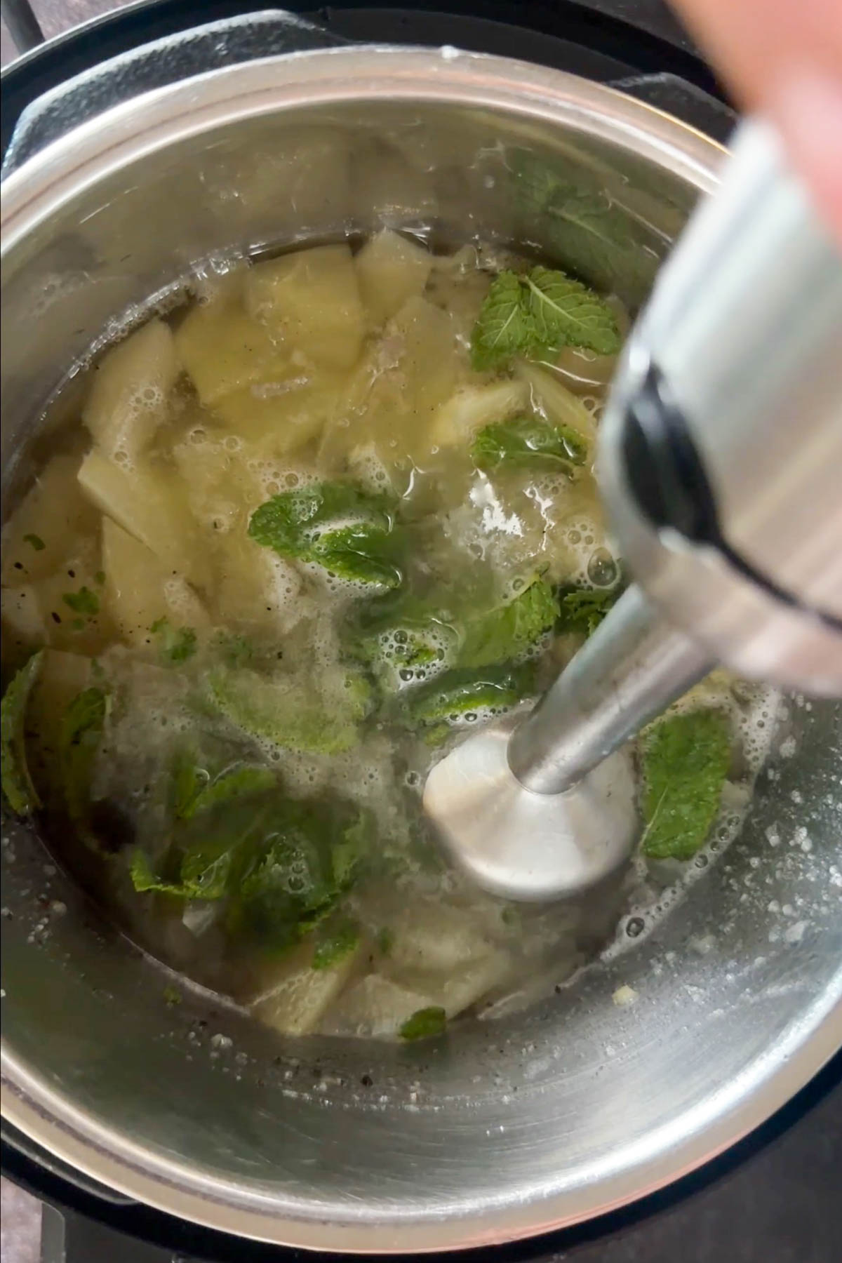 Blending cooked raw mango mixture for aam panna.