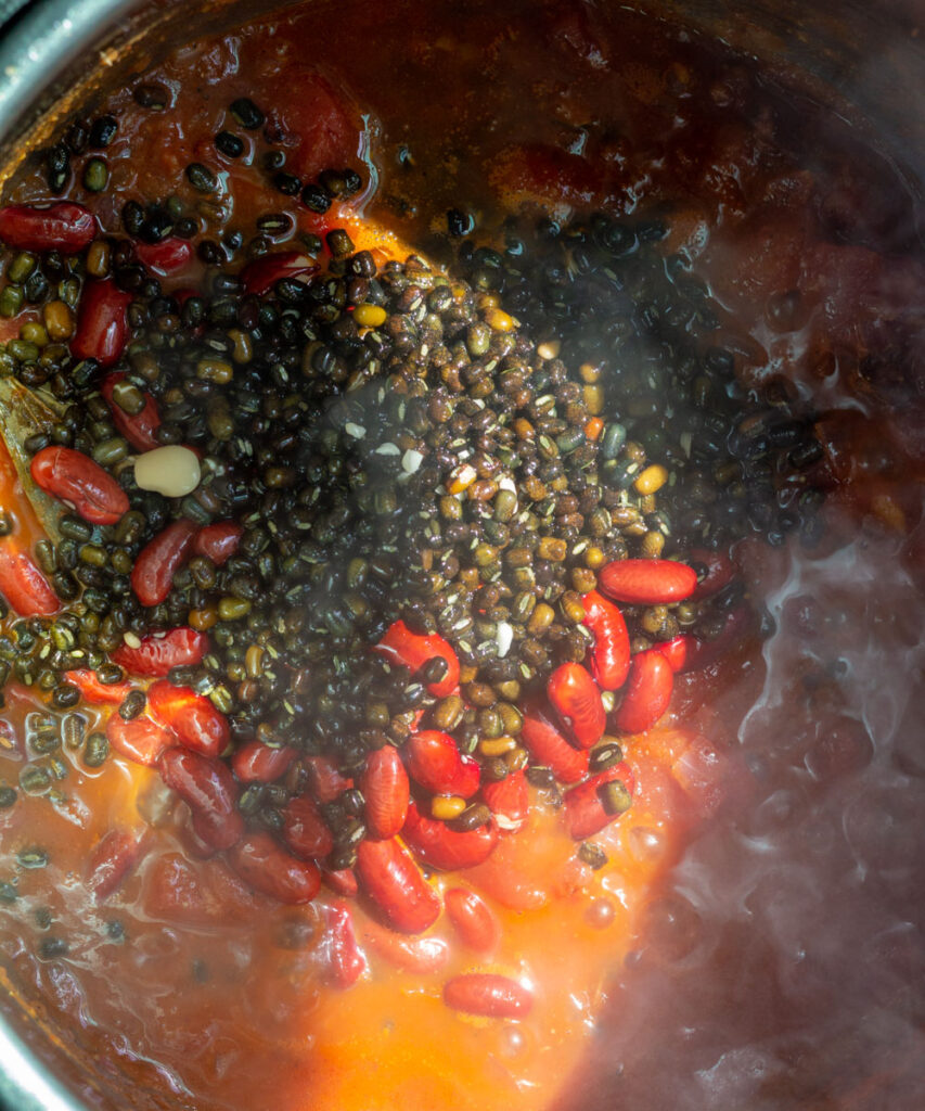 add soaked black lentils & kidney beans to the pot.
