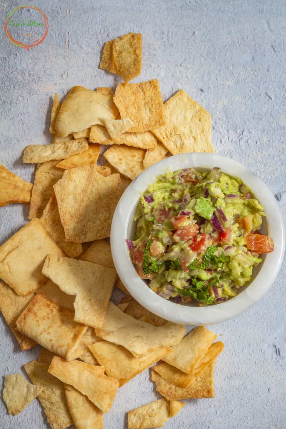 Jalapeno guacamole served in a white bowl.