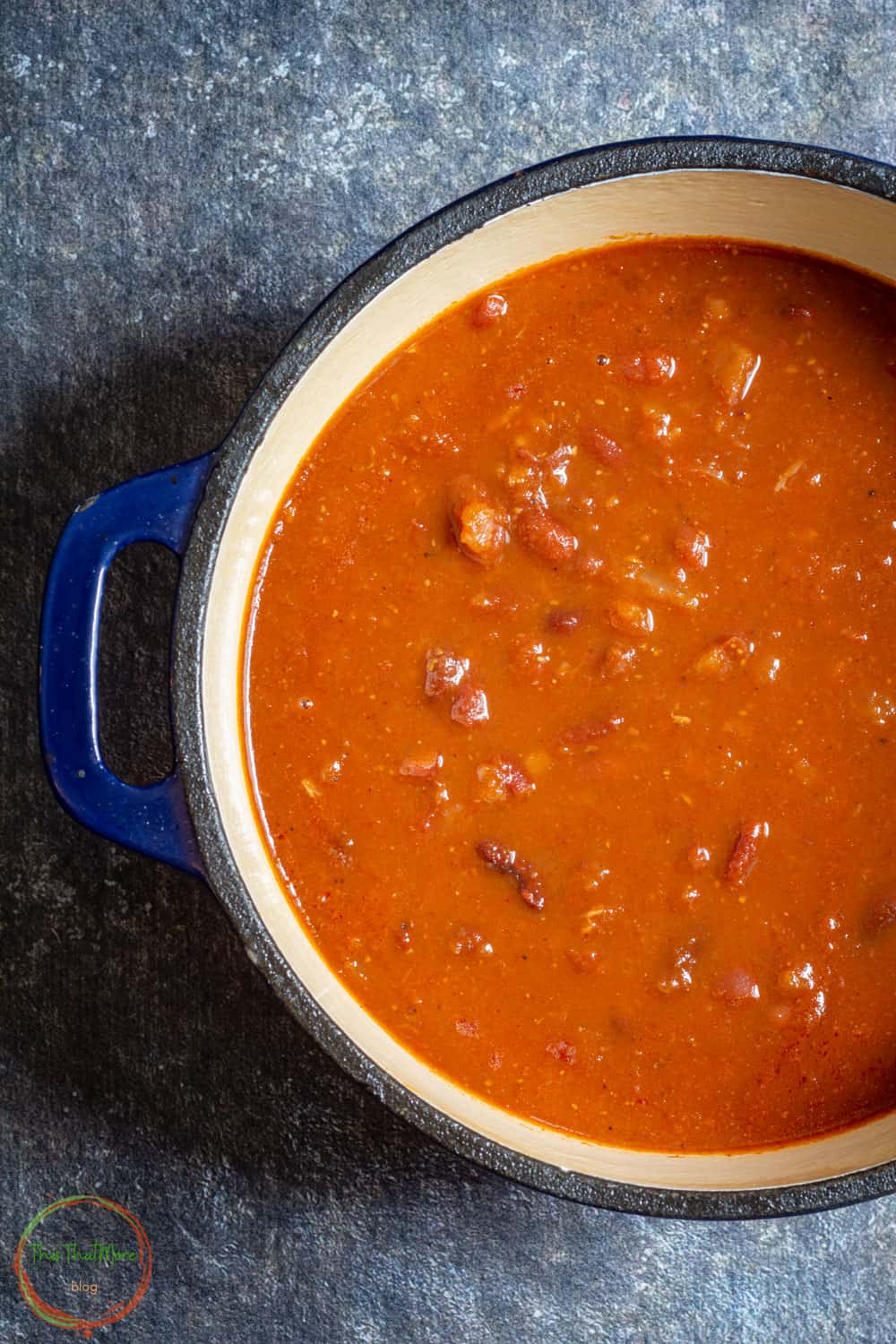 Rajma Masala served in a blue pot.