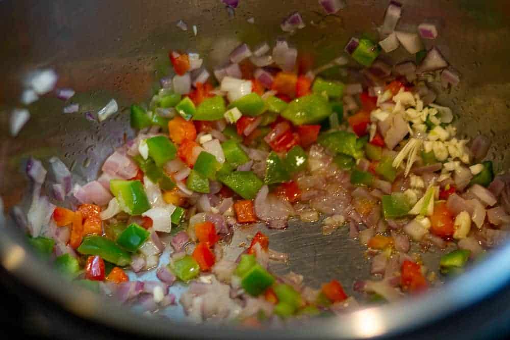 once veggies are cooked, add garlic to the pot
