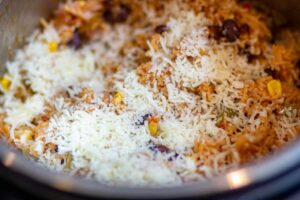 add some cheese on the rice and close the lid