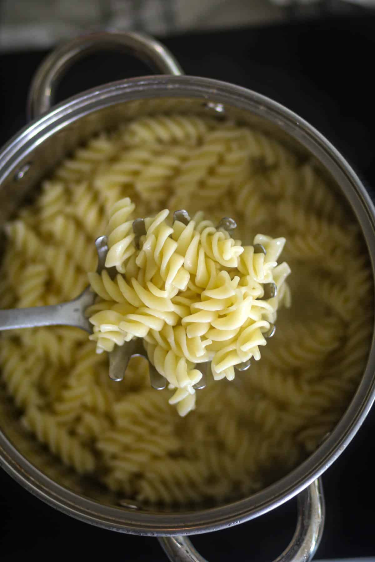 Strain pasta once they are cooked.