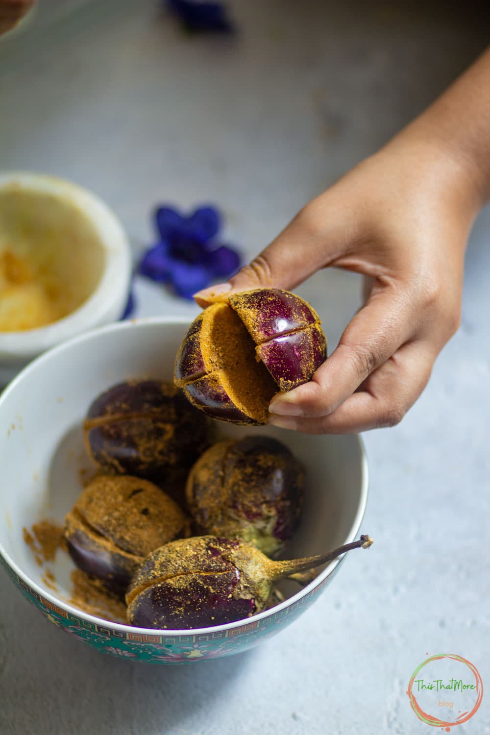 Stuff the eggplant and then cook in Kadai.