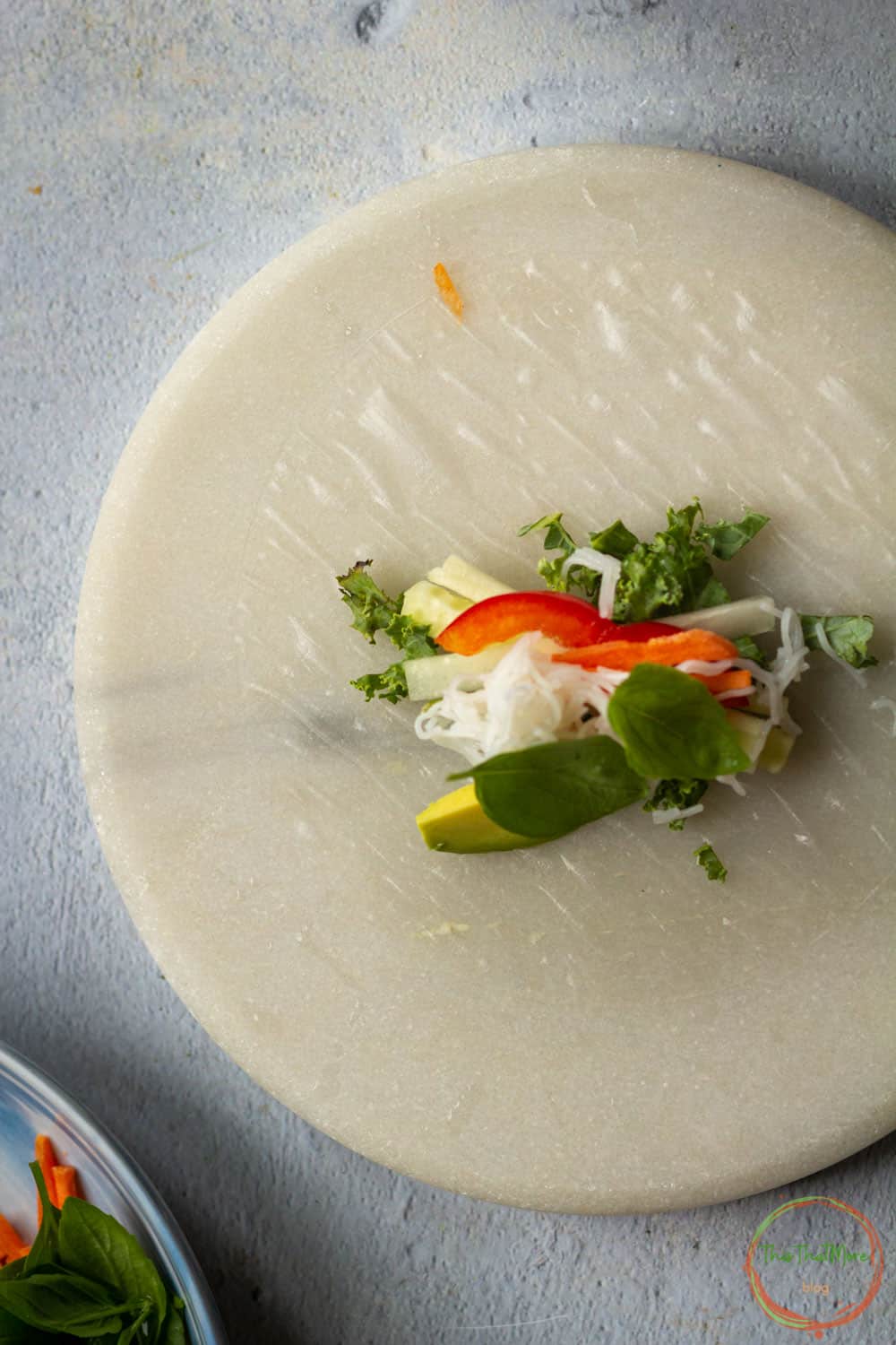 Add the veggies in the middle of the rice wrapper.