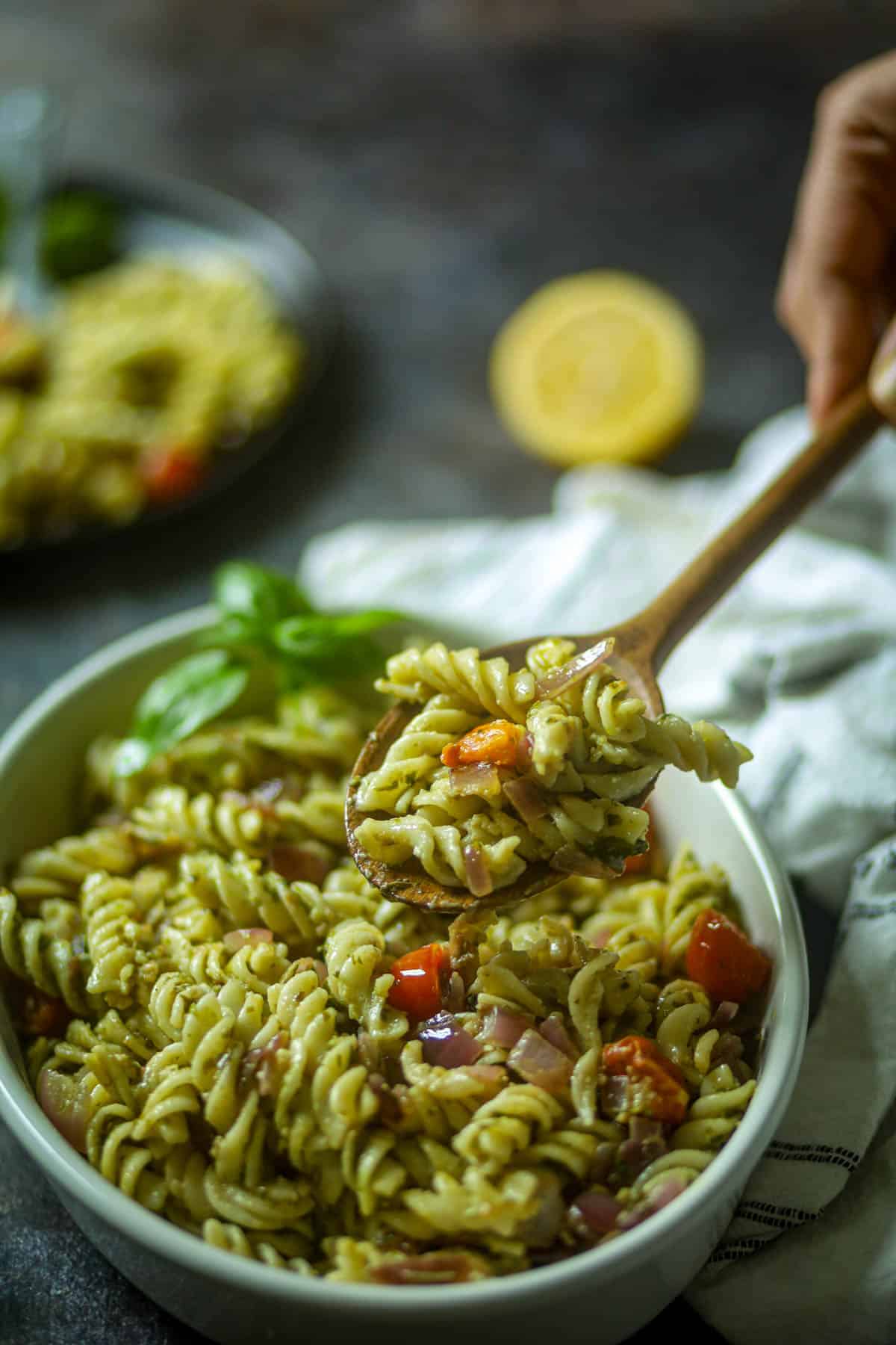 A side shot of pesto pasta.