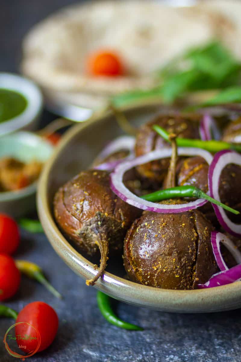 Bharwa Baingan served in a green bowl.