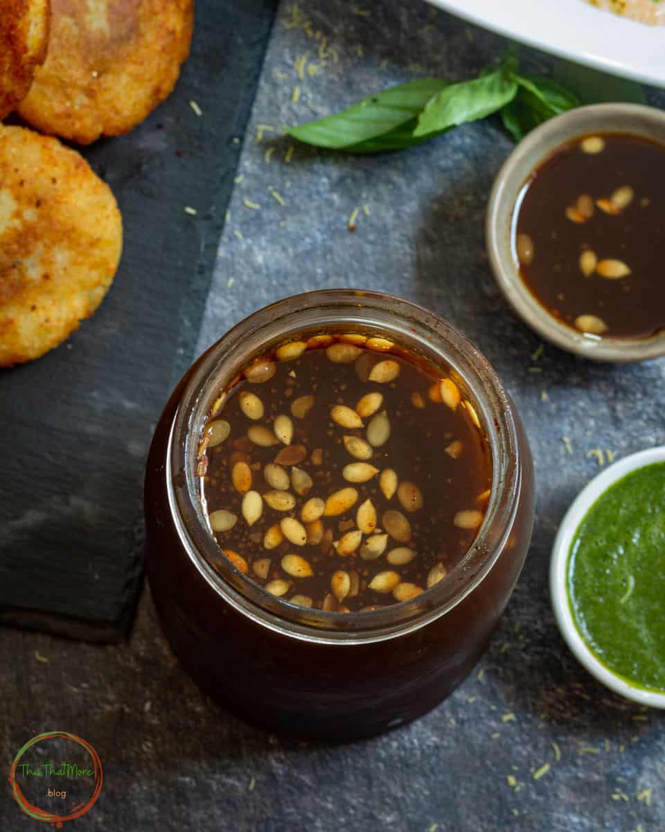 Imli Ki Meethi Chutney garnished with some melon seeds.