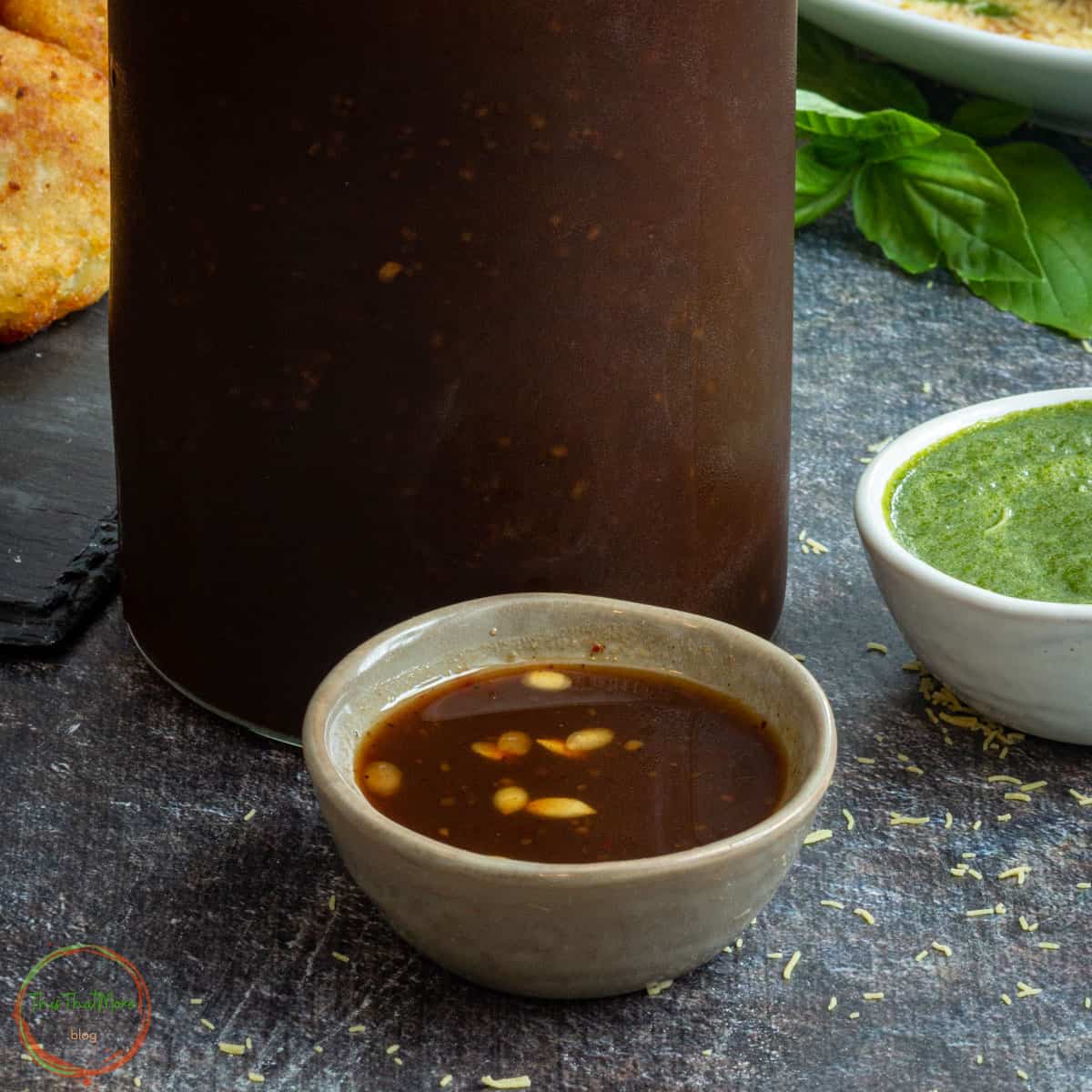 Imli chutney in a small cup.