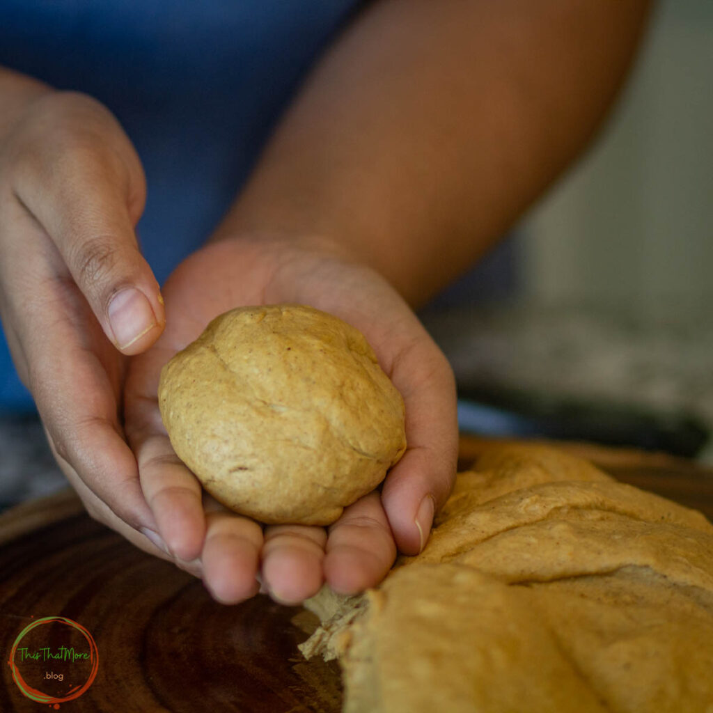 take a small portion of dough and roll it into a ball.