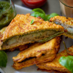 Bread Pakora served on a plate with sauces.