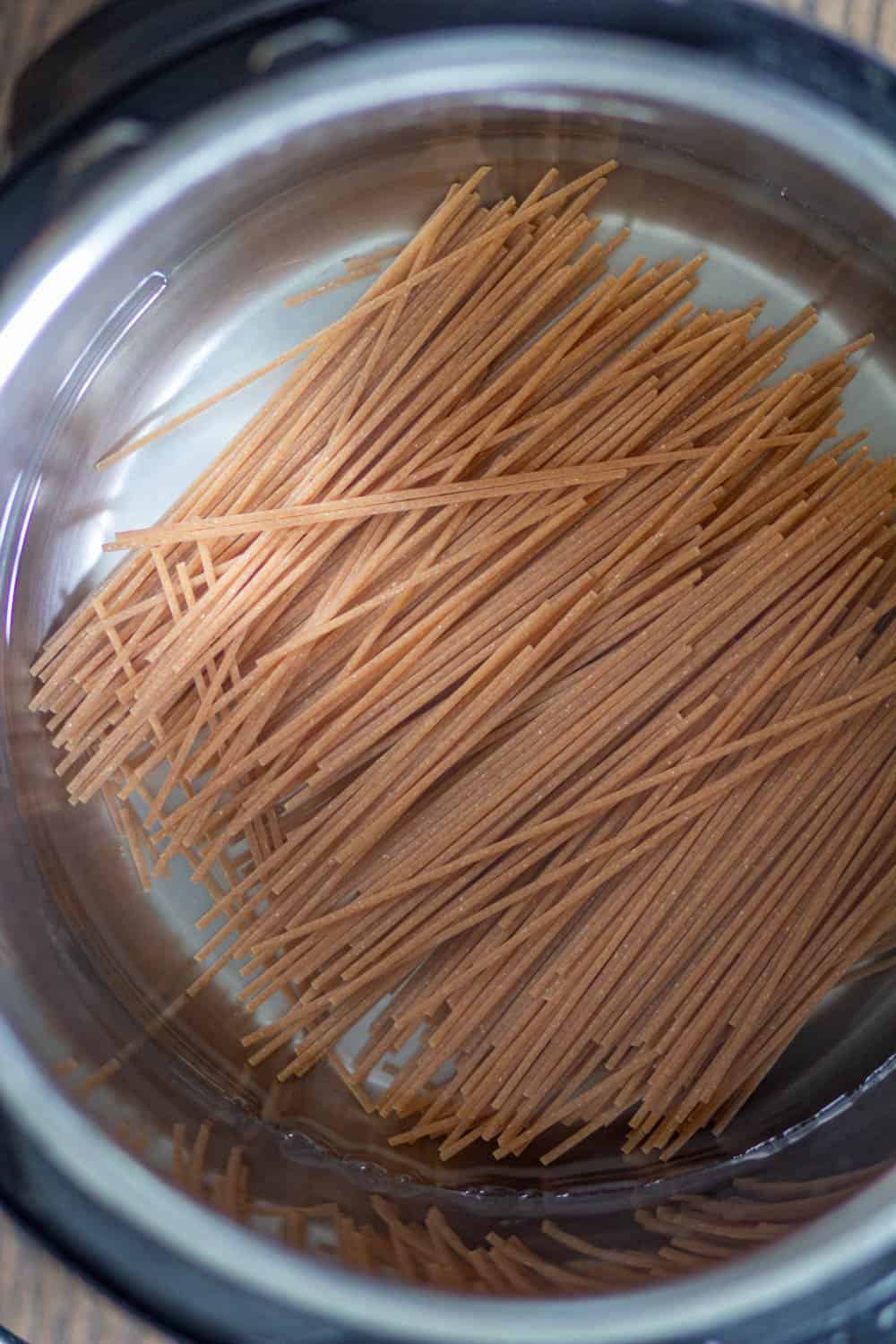 Add noodles and water in the instant pot.