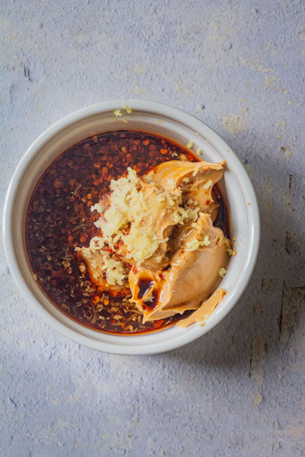 Add all the ingredients of peanut sauce in a bowl.
