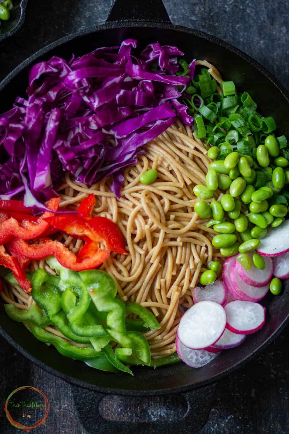 Add all the noodle salad ingredients in a salad bowl.