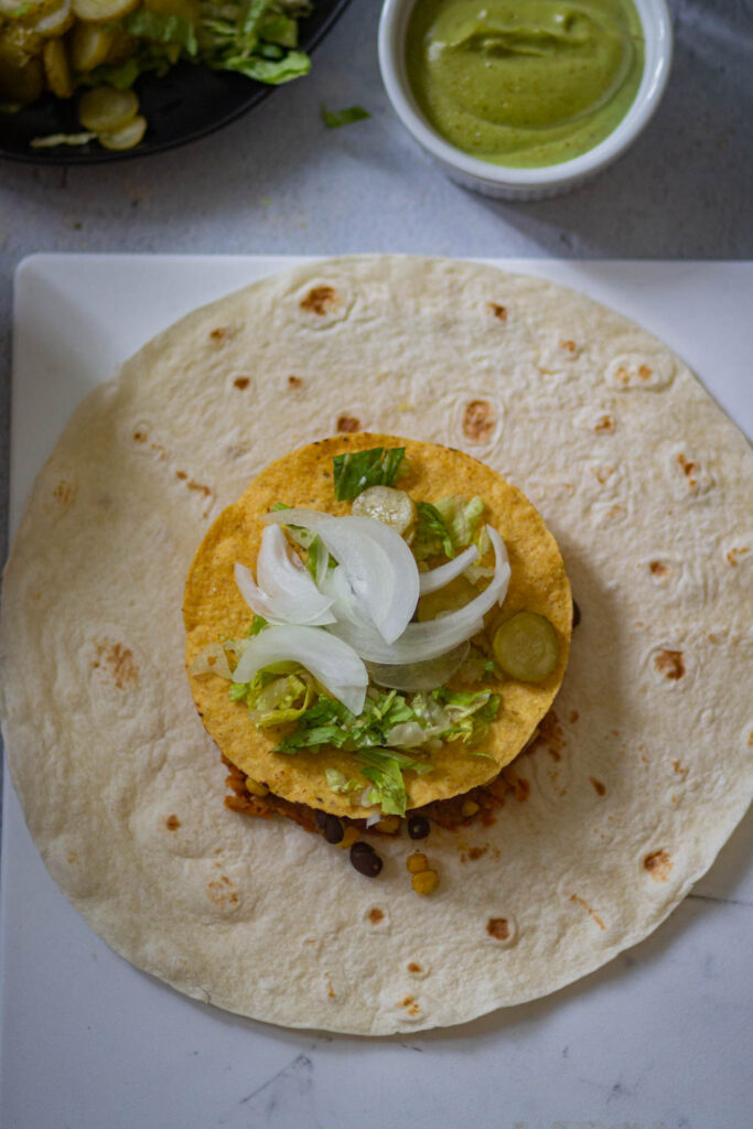 add some veggies over the tostada