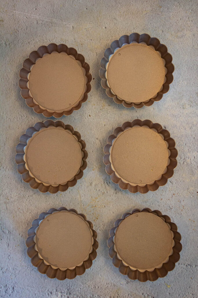 add oil in the tart pans