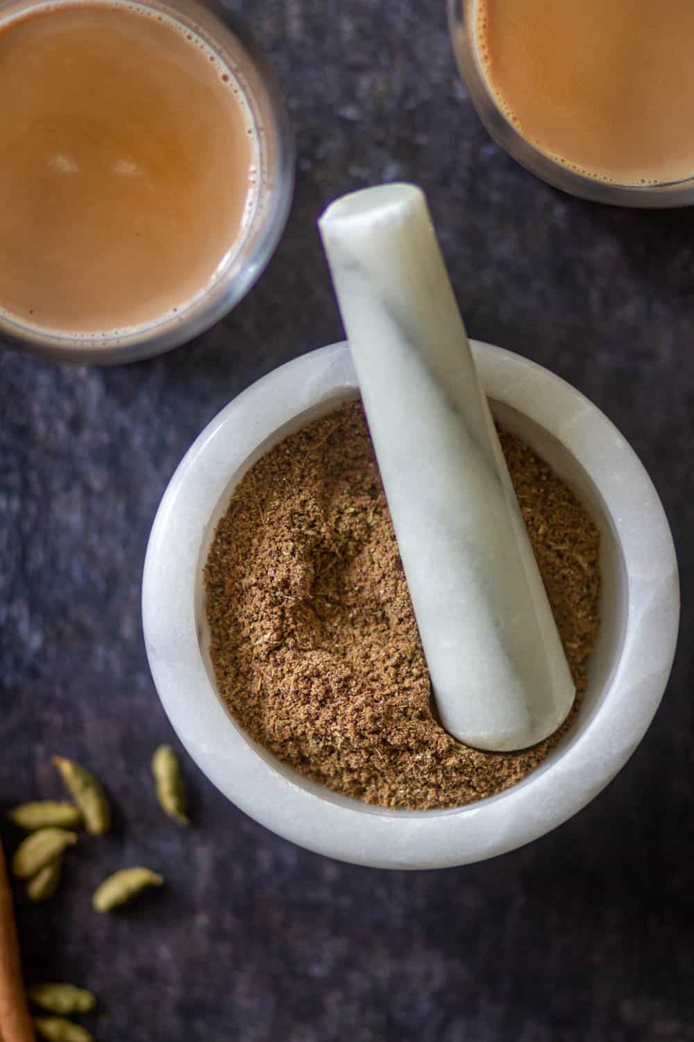 chai masala in a white mortar pestle