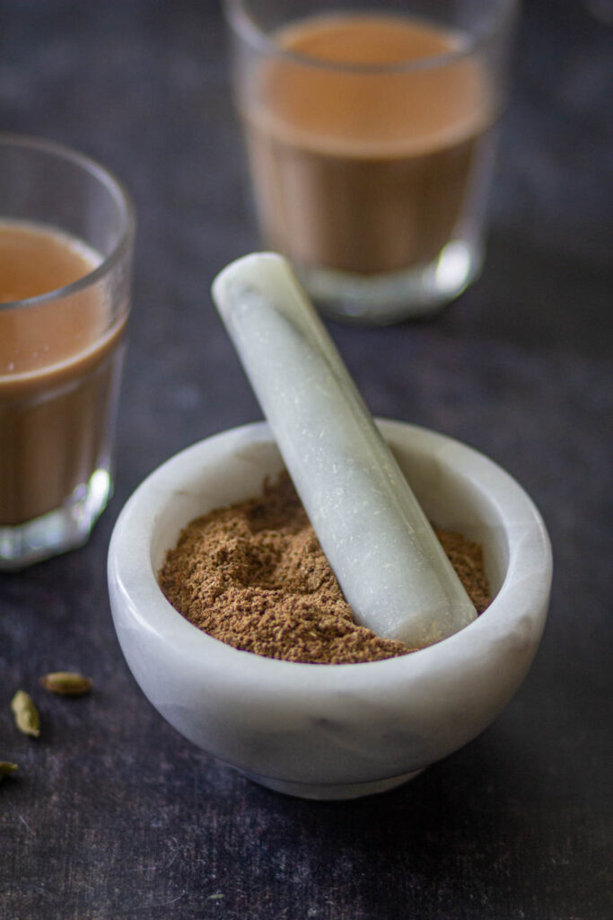chai masala with tea in the background.