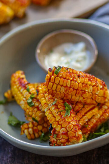 Air fryer corn ribs with spicy gochujang glaze.
