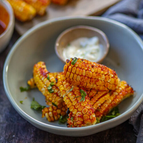 Air fryer corn ribs with spicy gochujang glaze.