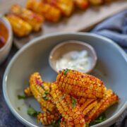 Air fryer gochujang corn ribs served with garlic yogurt dip.