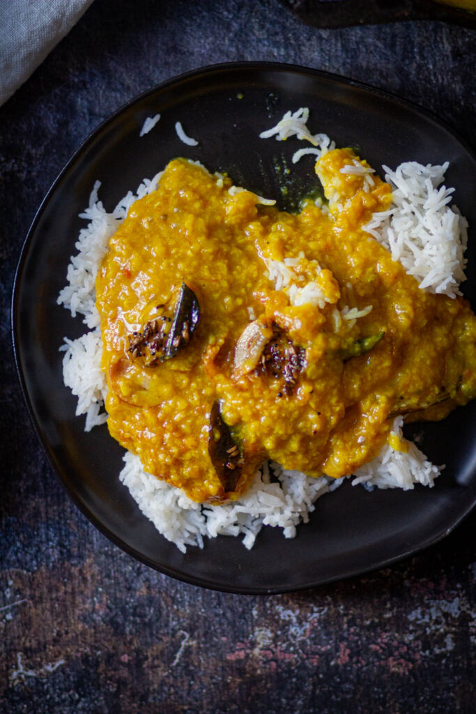 served moong dal tadka fry over rice with tempering.