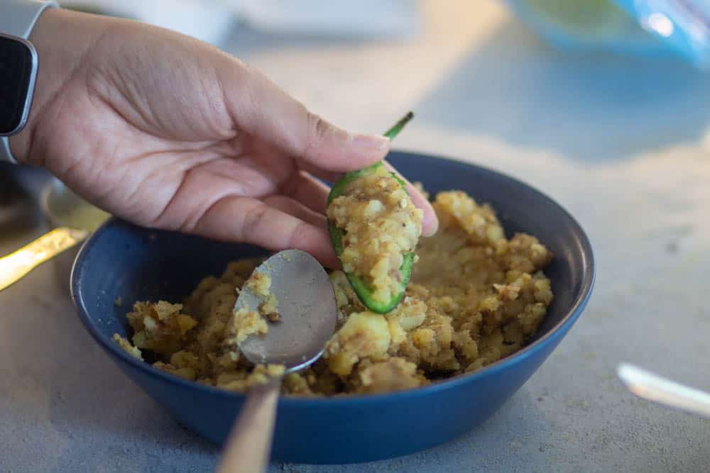 add potato stuffing inside the jalapenos